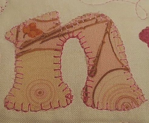 applique letter n, inappropriate fussy cut