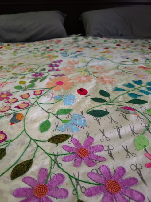 meadow quilt blanket stitch raw edge applique flower leaf vine ladybug bird